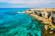 Rock cliffs and azure sea water near Cavo Greko peninsula, Cyprus island