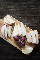 Wall Mural - mixed portuguese cheese tapas snack platter with apple and grapes