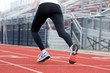 © coachwood - Female sprinter taking off down the track