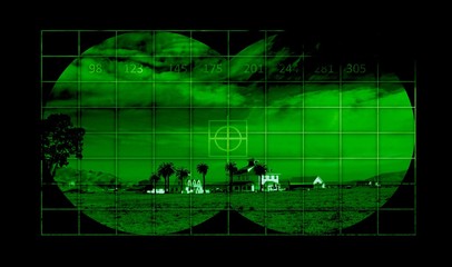 Houses in countryside through night vision