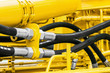 hydraulics pipes and nozzles, tractor or other construction equipment. focus on the hydraulic pipes