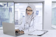 © Creativa Images - Muslim general doctor works with laptop
