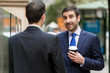 © Sergey Nivens - Two businessmen talking outdoors