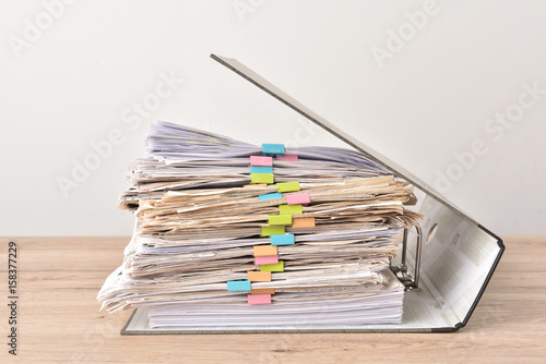 Fotografía Pile of Financial documents with colorful clips on wood desk stack up,back isola