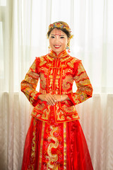 Wall Mural - Chinese bride in traditional red wedding dress