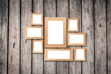 Collage of blank brown wooden frames , interior decor mock up on old wooden wall, vintage style