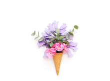 Creative Still Life . Ice Cream Waffle Cone With Flowers . Flat Lay, Top View, Copy Space