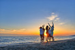 © FS-Stock - group of happy young people dancing at the beach on beautiful summer sunset