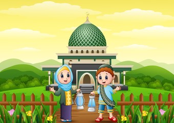 Wall Mural - Muslim boy and girl cartoon holding lantern