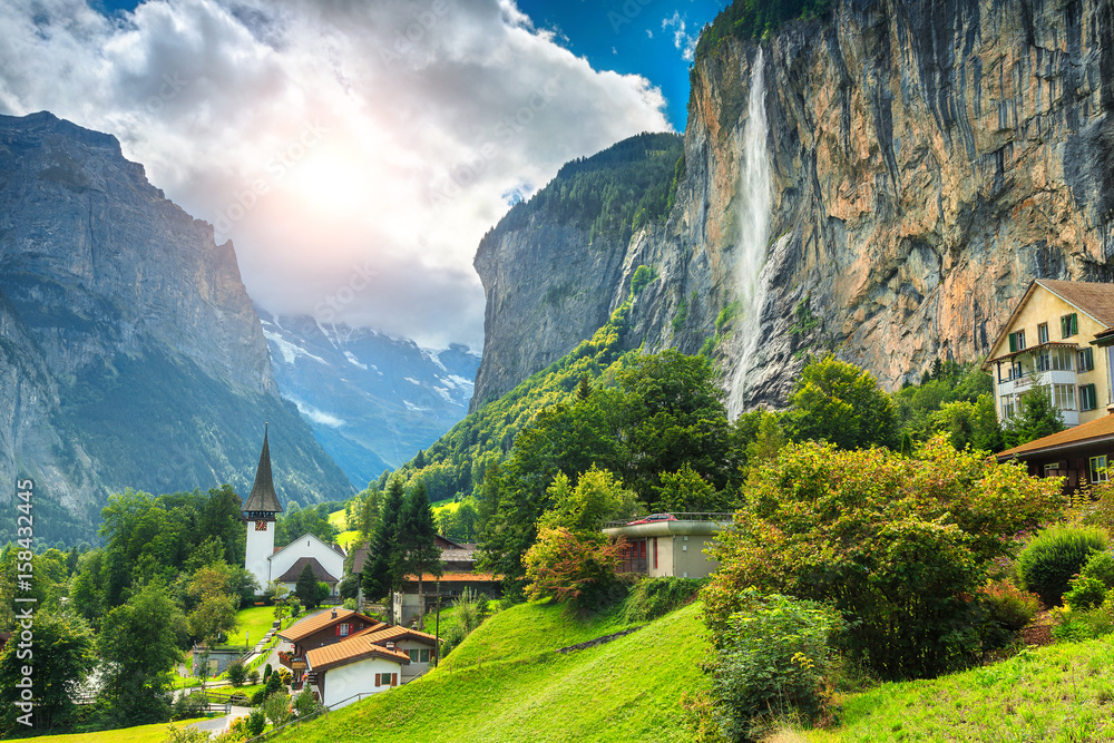 Fabulous mountain village with high cliffs and waterfalls, Lauterbrunnen, Switzerland - obrazy, fototapety, plakaty 