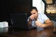 © alexkich - Armenian handsome man working behind laptop