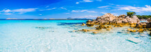 Clear Amazing Azure Coloured Sea Water With Gtanote Rocks In Capriccioli Beach, Sardinia, Italy