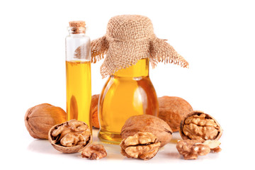 Wall Mural - Walnut oil with nuts isolated on a white background