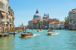 Water taxis sails on Grand Canal, Venice, Italy. Travel and vacation concept.