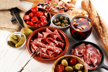 Wall Mural - spanish tapas and sangria on wooden table - mediterran antipasti set