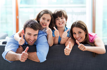 Poster - Family relaxing on sofa
