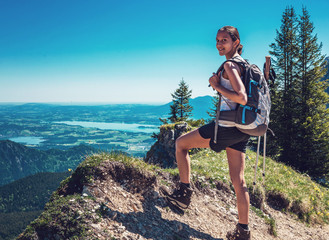 Wall Mural - female hiker ascending steep mountain trail
