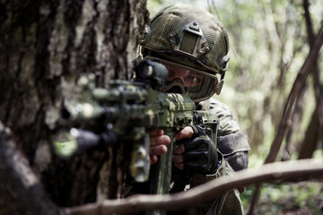 Wall Mural - Photo of soldier in woods