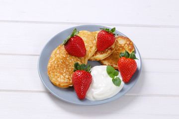 Wall Mural - american pancakes with yogurt and strawberries