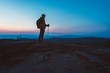 © Daniel Jędzura - Man tourist with trekking on top of hill