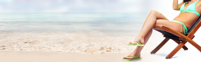 Canvas Print - Woman sunbathing on the beach