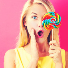 Young Woman Holding A Lollipop
