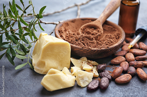 Cuadros en Lienzo Beautiful composition with cocoa butter lotion and ingredients on table