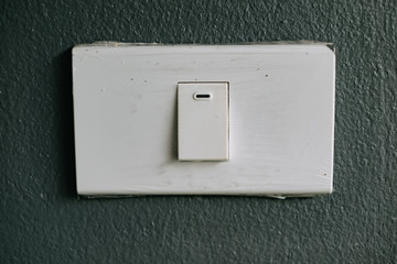 Light switch on the grey wall