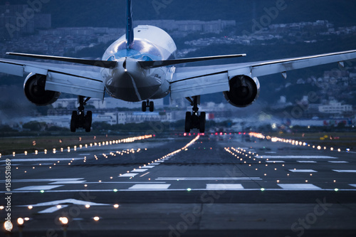 Cuadros en Lienzo In the evening, the plane is about to land on the runway