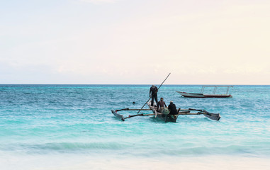 Wall Mural - beautiful colorful seascape with fishing boats and fishermen, Zanzibar