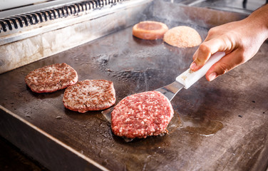 Chef cook frying meat