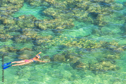Woman Snorkeling Over Coral Reef In Famous Hanauma Bay Nature Preserve Oahu Island Hawaii Usa Female Snorkeler Swims In Tropical Sea With American Flag Bikini Watersport Activity In Hawaii Stock Photo