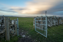 Open Gate To Field At Sunset