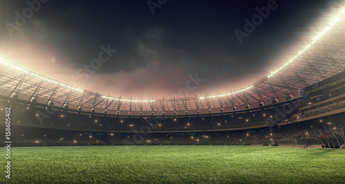 soccer-stadium-with-green-grass-illumination-lights-and-dramatic-night-sky