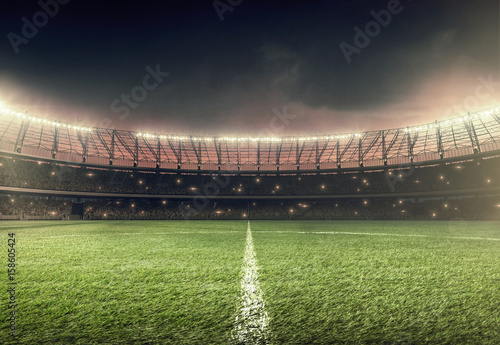 Fotografía soccer stadium with green grass and illumination lights at night