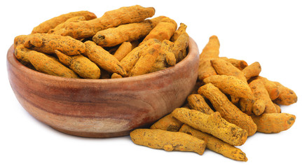 Canvas Print - Whole turmeric in a bowl