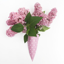 Bunch Of Lilac Flowers In Paper Cone On White Background From Above, Flat Lay