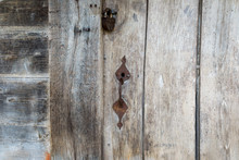 Natural Material. Old Metal Rusty Padlock, Bolt On A Wooden Door. Old Wooden Brown Background Close-up.