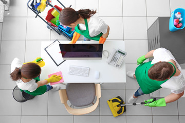 Wall Mural - Cleaning service team working in office