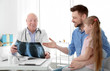 © Africa Studio - Little girl with father at orthopedist's office