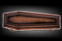 Closed Wooden Brown Coffin Covered With Cloth Isolated On Gray Luxury Background. Casket With Shadow On Background.