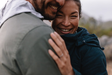 Wall Mural - Romantic couple embracing each other and smiling