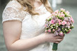 © CL-Medien - Wedding bouquet of flowers held by a bride. Pink, yellow and Green