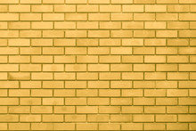 Golden Wall. Luxury Gold Rich Home Brick Background.