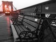 park bench and red light from police car at Brooklyn bridge in vintage style