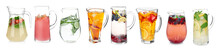 Different Drinks In Glass Jugs On White Background. Ideas For Summer Cocktails