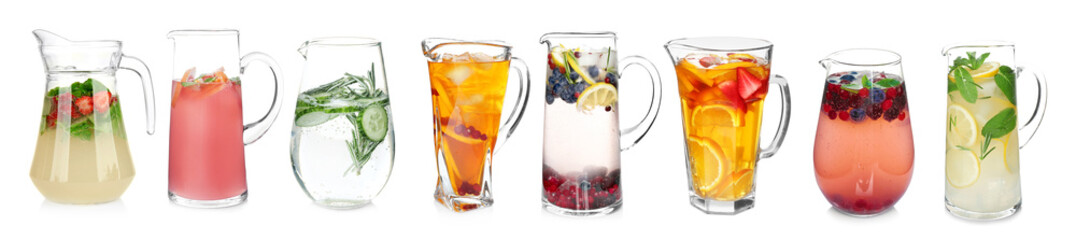 Canvas Print - Different drinks in glass jugs on white background. Ideas for summer cocktails