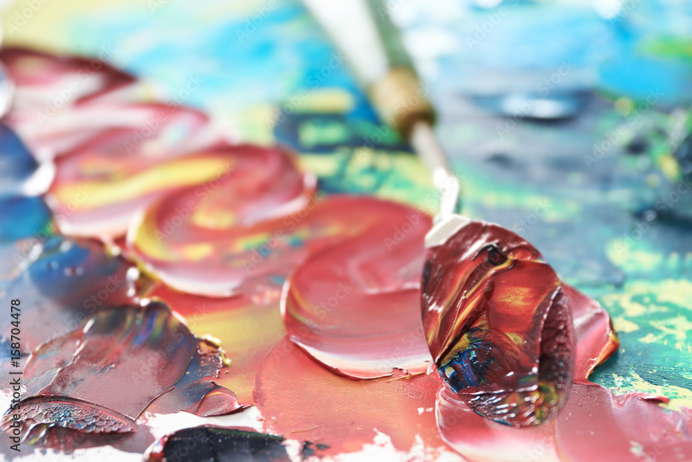 Colorful oil paint with palette knife, closeup