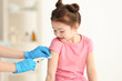 © Africa Studio - Vaccination concept. Female doctor vaccinating cute little girl in clinic