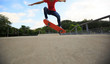 © lzf - young skateboarder legs skateboarding at skatepark
